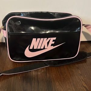 Black and pink Nike patent leather bag